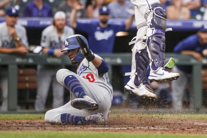 Jul 17, 2021; Denver, Colorado, USA; Los Angeles Dodgers right fielder Mookie Betts (50) scores a run against the Colorado Rockies in the sixth inning at Coors Field. Mandatory Credit: Michael Ciaglo-USA TODAY Sports