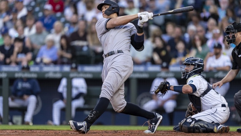 Jul 7, 2021; Seattle, Washington, USA; New York Yankees outfielder Aaron Judge (99) hits a home run during a game against the Seattle Mariners at T-Mobile Park. The Yankees won 5-4. Mandatory Credit: Stephen Brashear-USA TODAY Sports