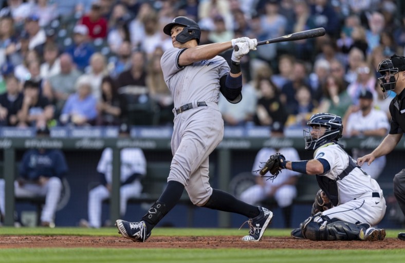 Jul 7, 2021; Seattle, Washington, USA; New York Yankees outfielder Aaron Judge (99) hits a home run during a game against the Seattle Mariners at T-Mobile Park. The Yankees won 5-4. Mandatory Credit: Stephen Brashear-USA TODAY Sports