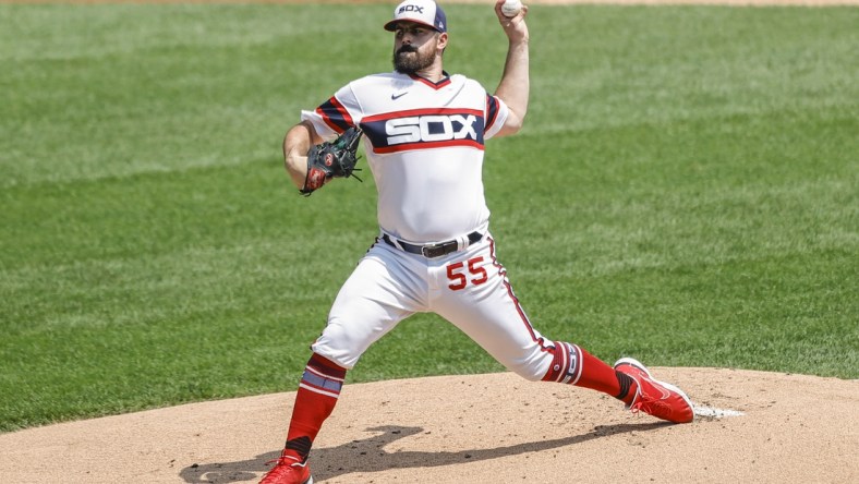 Jul 18, 2021; Chicago, Illinois, USA; Chicago White Sox starting pitcher Carlos Rodon (55) throws a pitch against the Houston Astros during the first inning at Guaranteed Rate Field. Mandatory Credit: Kamil Krzaczynski-USA TODAY Sports