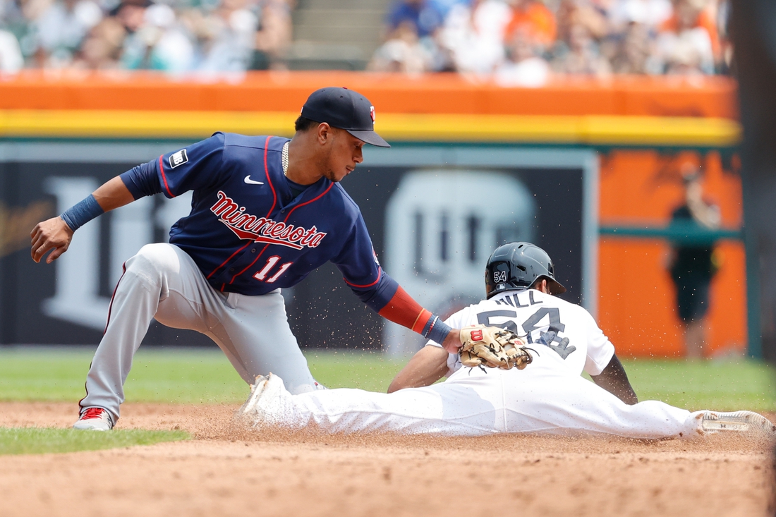 Jul 18, 2021; Detroit, Michigan, USA;  Detroit Tigers center fielder Derek Hill (54) steals second ahead of the tag by Minnesota Twins shortstop Jorge Polanco (11) in the second inning  at Comerica Park. Mandatory Credit: Rick Osentoski-USA TODAY Sports