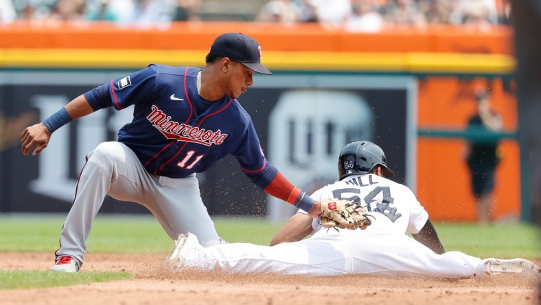 Jul 18, 2021; Detroit, Michigan, USA;  Detroit Tigers center fielder Derek Hill (54) steals second ahead of the tag by Minnesota Twins shortstop Jorge Polanco (11) in the second inning  at Comerica Park. Mandatory Credit: Rick Osentoski-USA TODAY Sports