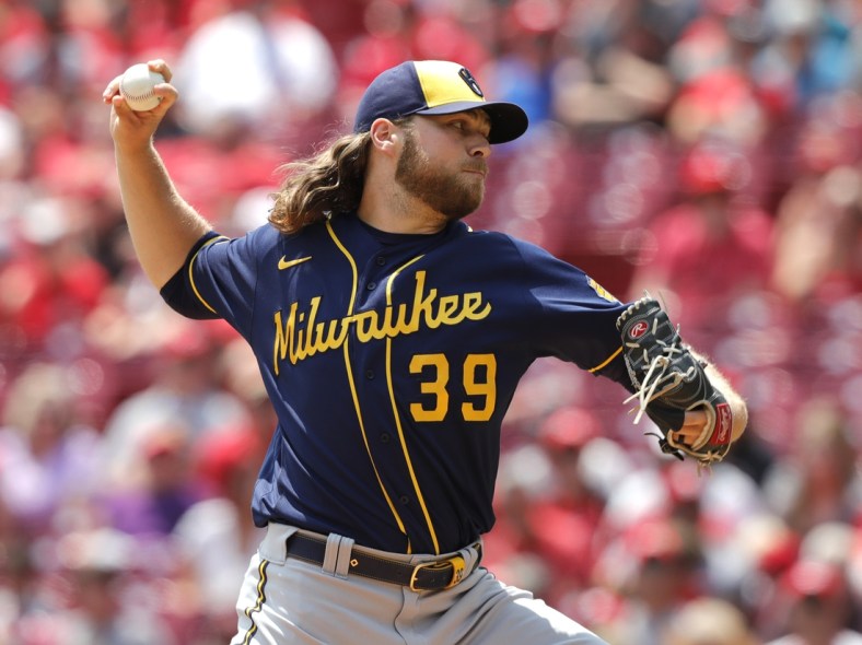 Jul 18, 2021; Cincinnati, Ohio, USA; Milwaukee Brewers starting pitcher Corbin Burnes (39) throws a pitch against the Cincinnati Reds during the first inning at Great American Ball Park. Mandatory Credit: David Kohl-USA TODAY Sports