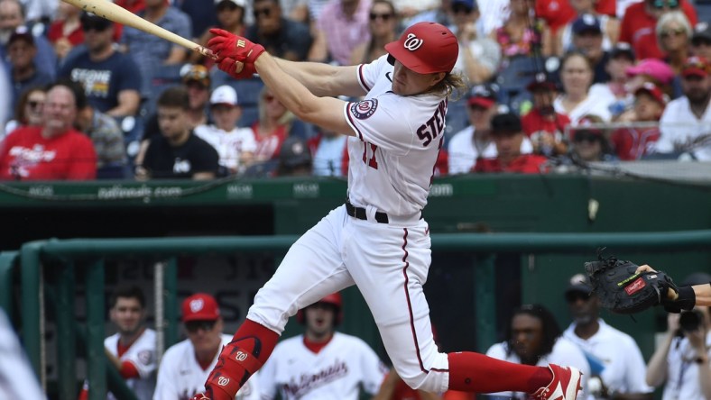 Jul 18, 2021; Washington, District of Columbia, USA; Washington Nationals outfielder Andrew Stevenson hits an RBI double against the San Diego Padres during the third inning at Nationals Park. Mandatory Credit: Brad Mills-USA TODAY Sports