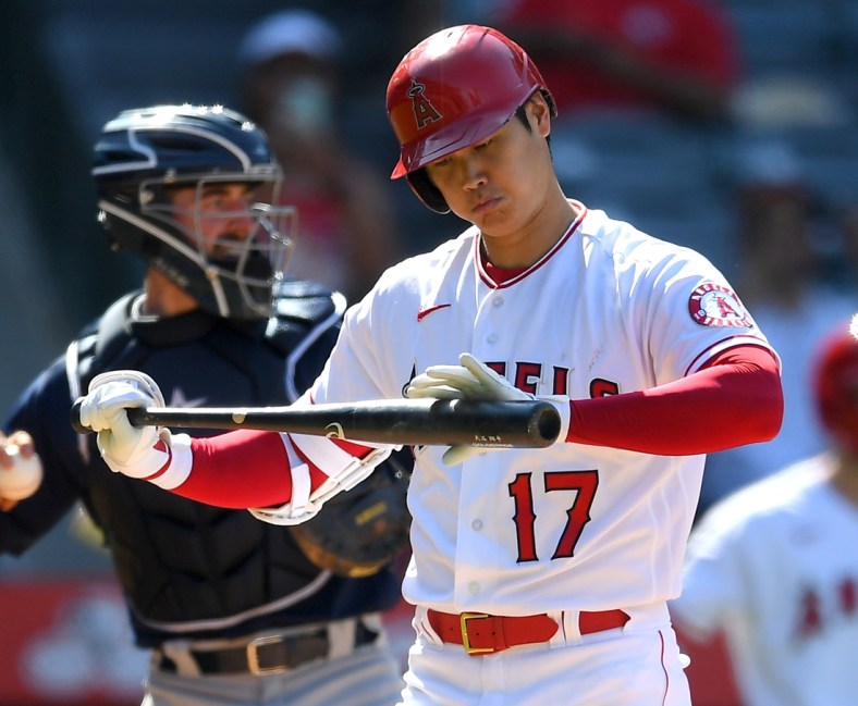 Jul 18, 2021; Anaheim, California, USA;  Los Angeles Angels designated hitter Shohei Ohtani (17) checks his bat in the ninth inning of the game against the Seattle Mariners at Angel Stadium. Mandatory Credit: Jayne Kamin-Oncea-USA TODAY Sports