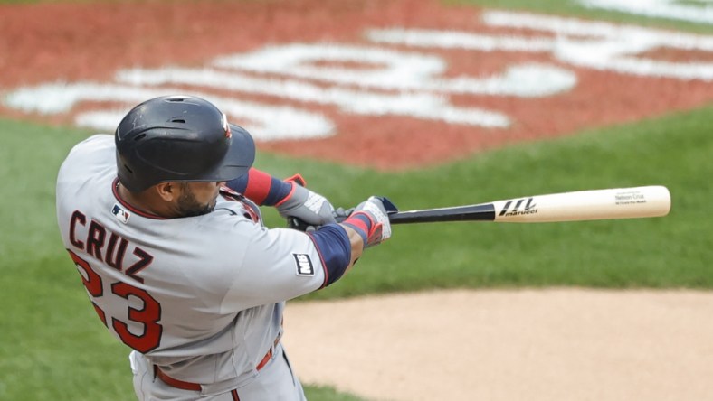 Jul 19, 2021; Chicago, Illinois, USA; Minnesota Twins designated hitter Nelson Cruz (23) hits a solo home run against the Chicago White Sox during the sixth inning of a Game 1 of the doubleheader at Guaranteed Rate Field. Mandatory Credit: Kamil Krzaczynski-USA TODAY Sports