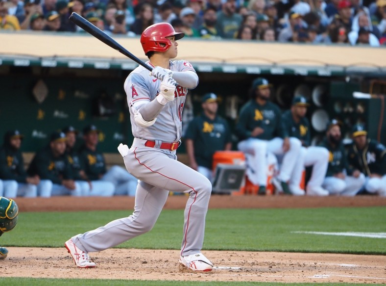 Jul 19, 2021; Oakland, California, USA; Los Angeles Angels designated hitter Shohei Ohtani (17) hits a double against the Oakland Athletics during the third inning at RingCentral Coliseum. Mandatory Credit: Kelley L Cox-USA TODAY Sports