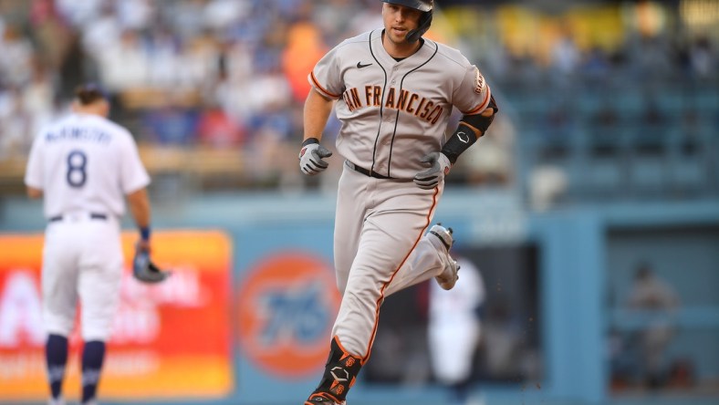 Jul 19, 2021; Los Angeles, California, USA;  San Francisco Giants catcher Buster Posey (28) rounds the bases after hitting a two run home run in the first inning against the Los Angeles Dodgers at Dodger Stadium. Mandatory Credit: Jayne Kamin-Oncea-USA TODAY Sports