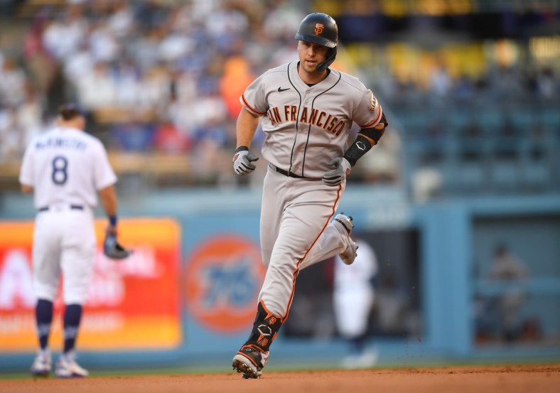 Jul 19, 2021; Los Angeles, California, USA;  San Francisco Giants catcher Buster Posey (28) rounds the bases after hitting a two run home run in the first inning against the Los Angeles Dodgers at Dodger Stadium. Mandatory Credit: Jayne Kamin-Oncea-USA TODAY Sports