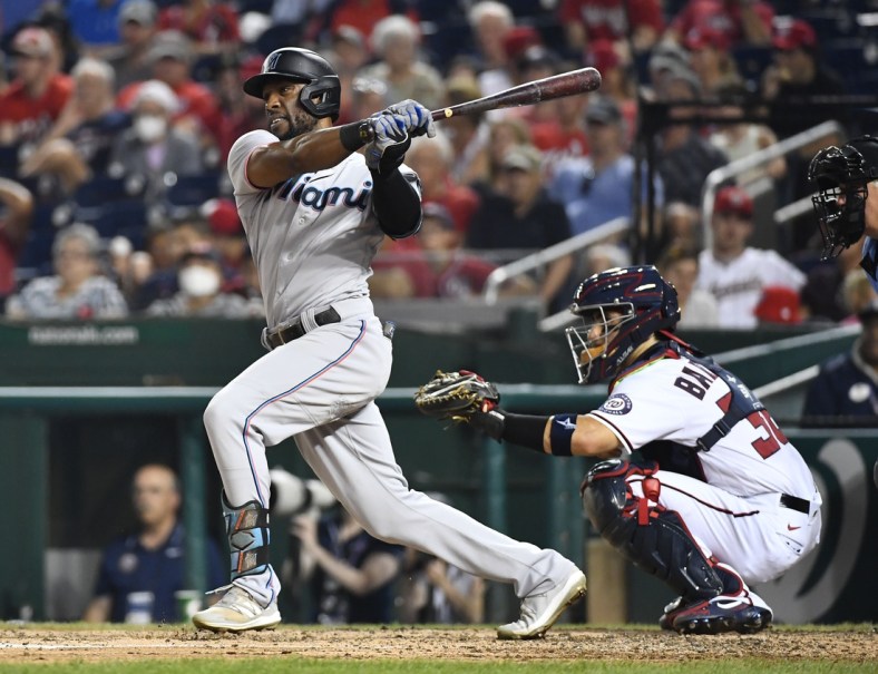 Jul 20, 2021; Washington, District of Columbia, USA; Miami Marlins center fielder Starling Marte (6) hits a single against the Washington Nationals during the sixth inning at Nationals Park. Mandatory Credit: Brad Mills-USA TODAY Sports