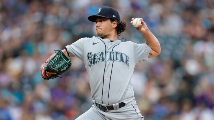 Jul 20, 2021; Denver, Colorado, USA; Seattle Mariners starting pitcher Marco Gonzales (7) pitches in the second inning against the Colorado Rockies at Coors Field. Mandatory Credit: Isaiah J. Downing-USA TODAY Sports