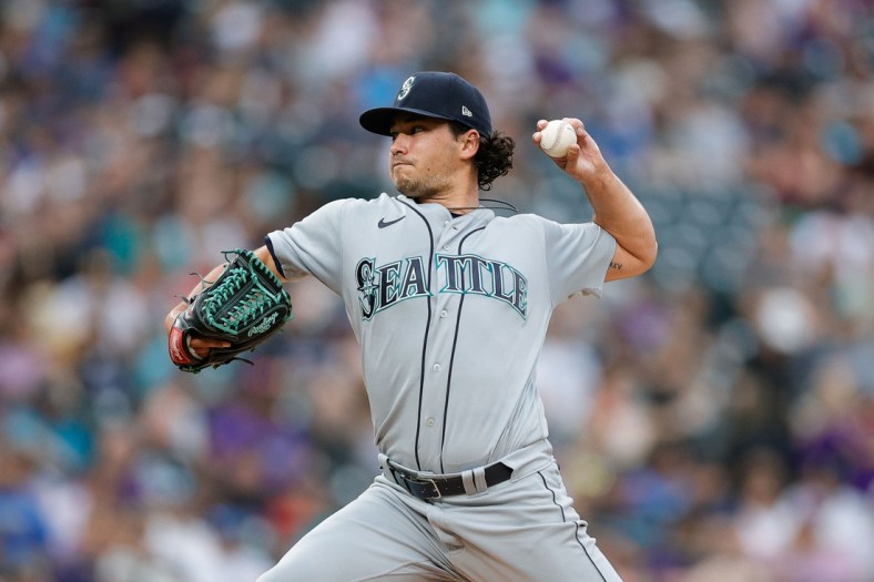 Jul 20, 2021; Denver, Colorado, USA; Seattle Mariners starting pitcher Marco Gonzales (7) pitches in the second inning against the Colorado Rockies at Coors Field. Mandatory Credit: Isaiah J. Downing-USA TODAY Sports
