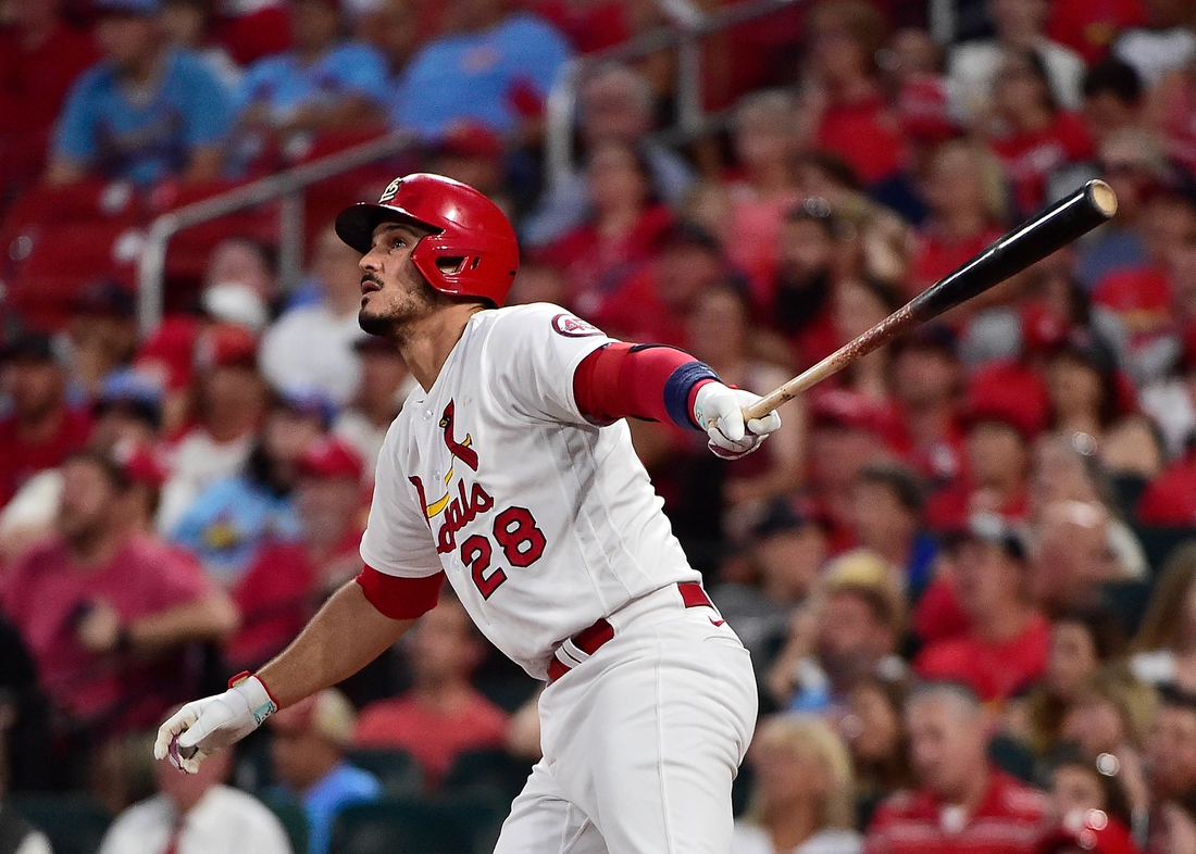 Jul 20, 2021; St. Louis, Missouri, USA;  St. Louis Cardinals third baseman Nolan Arenado (28) hits a solo home run off of Chicago Cubs starting pitcher Trevor Williams (not pictured) during the fourth inning at Busch Stadium. Mandatory Credit: Jeff Curry-USA TODAY Sports