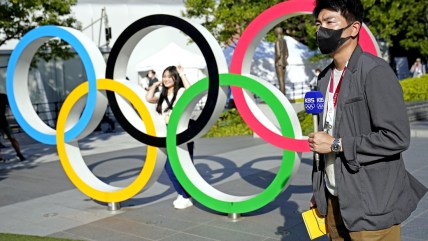 Nearly 2,000 new COVID cases in Tokyo on eve of Olympics