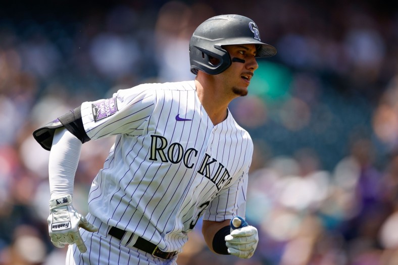 Jul 21, 2021; Denver, Colorado, USA; Colorado Rockies catcher Dom Nunez (3) runs to second base on a three-RBI double in the first inning against the Seattle Mariners at Coors Field. Mandatory Credit: Isaiah J. Downing-USA TODAY Sports