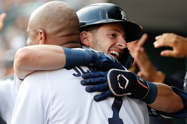 Jul 21, 2021; Detroit, Michigan, USA; Detroit Tigers shortstop Zack Short (59) receives congratulations from first baseman Jonathan Schoop (7) after he hit a two run home run in the second inning against the Texas Rangers at Comerica Park. Mandatory Credit: Rick Osentoski-USA TODAY Sports