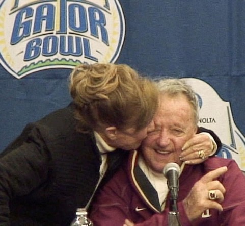Jan. 1, 2010: Legendary Florida State University football coach Bobby Bowden's wife, Ann, gives him a kiss during the post game press conference after his final game against West Virginia at Jacksonville Municipal Stadium for the Gator Bowl. [Kelly Jordan, Florida Times-Union]