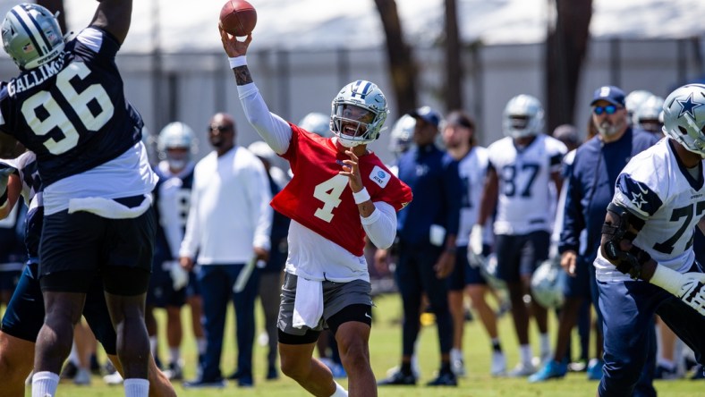 Jul 22, 2021; Oxnard, CA, USA; Dallas Cowboys quarterback Dak Prescott (4) during training camp practice at the Marriott Residence Inn. Mandatory Credit: Jason Parkhurst-USA TODAY Sports