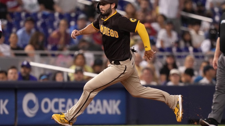 Jul 22, 2021; Miami, Florida, USA; San Diego Padres first baseman Eric Hosmer (30) advances to third base on a wild pitch by Miami Marlins relief pitcher Jordan Holloway (not pictured) in the 2nd inning at loanDepot park. Mandatory Credit: Jasen Vinlove-USA TODAY Sports