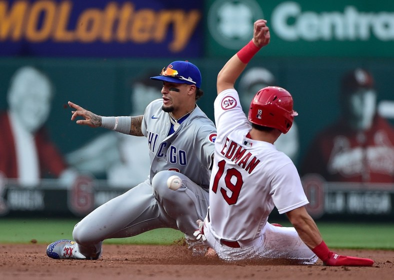 Jul 22, 2021; St. Louis, Missouri, USA;  Chicago Cubs shortstop Javier Baez (9) catches the throw and tags out St. Louis Cardinals second baseman Tommy Edman (19) as he attempts to steal second during the second inning at Busch Stadium. Mandatory Credit: Jeff Curry-USA TODAY Sports
