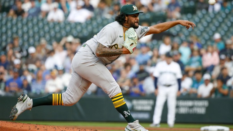 Jul 22, 2021; Seattle, Washington, USA; Oakland Athletics starting pitcher Sean Manaea (55) throws against the Seattle Mariners during the first inning at T-Mobile Park. Mandatory Credit: Joe Nicholson-USA TODAY Sports