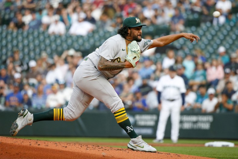 Jul 22, 2021; Seattle, Washington, USA; Oakland Athletics starting pitcher Sean Manaea (55) throws against the Seattle Mariners during the first inning at T-Mobile Park. Mandatory Credit: Joe Nicholson-USA TODAY Sports