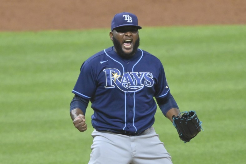Jul 22, 2021; Cleveland, Ohio, USA; Tampa Bay Rays relief pitcher Diego Castillo (63) celebrates a win over the Cleveland Indians at Progressive Field. Mandatory Credit: David Richard-USA TODAY Sports