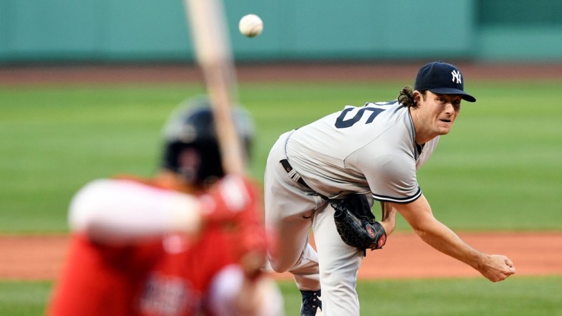 Jul 23, 2021; Boston, Massachusetts, USA; New York Yankees starting pitcher Gerrit Cole (45) pitches against the Boston Red Sox during the first inning at Fenway Park. Mandatory Credit: Brian Fluharty-USA TODAY Sports