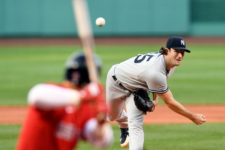 Jul 23, 2021; Boston, Massachusetts, USA; New York Yankees starting pitcher Gerrit Cole (45) pitches against the Boston Red Sox during the first inning at Fenway Park. Mandatory Credit: Brian Fluharty-USA TODAY Sports