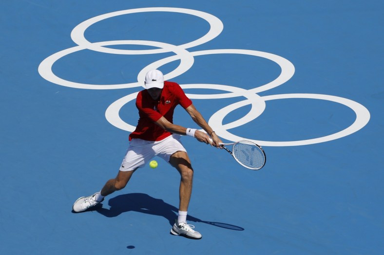 Jul 24, 2021; Tokyo, Japan; Daniil Medvedev of the Russian Olympic Committee hits a backhand against Alexander Bublik of Kazakhstan (not pictured) in a first round men's singles match during the Tokyo 2020 Olympic Summer Games at Ariake Tennis Park. Mandatory Credit: Geoff Burke-USA TODAY Network