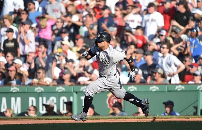 Jul 24, 2021; Boston, Massachusetts, USA; New York Yankees second baseman Rougned Odor (12) runs to second after hitting an RBI double during the eighth inning against the Boston Red Sox at Fenway Park. Mandatory Credit: Bob DeChiara-USA TODAY Sports