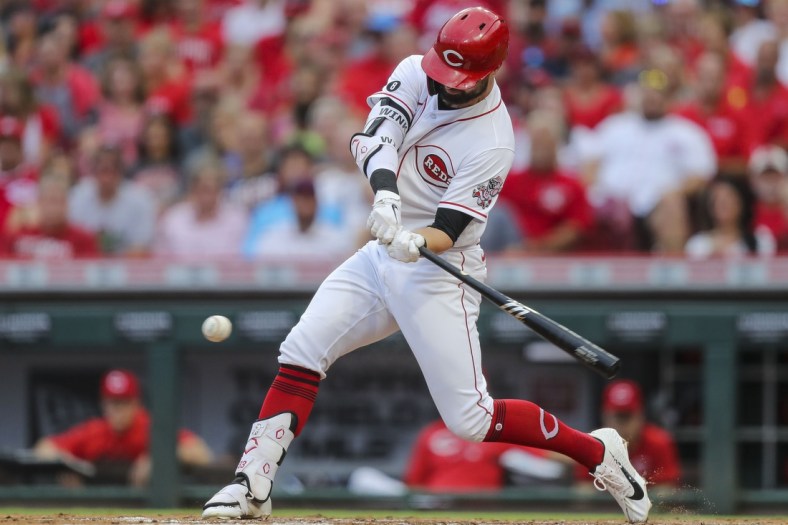 Jul 24, 2021; Cincinnati, Ohio, USA; Cincinnati Reds left fielder Jesse Winker (33) hits a RBI double against the St. Louis Cardinals in the second inning at Great American Ball Park. Mandatory Credit: Katie Stratman-USA TODAY Sports