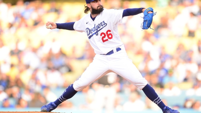 Jul 24, 2021; Los Angeles, California, USA; Los Angeles Dodgers starting pitcher Tony Gonsolin (26) throws against the Colorado Rockies during the first inning at Dodger Stadium. Mandatory Credit: Gary A. Vasquez-USA TODAY Sports