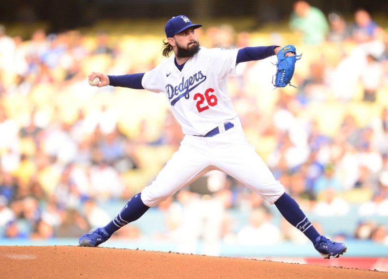 Jul 24, 2021; Los Angeles, California, USA; Los Angeles Dodgers starting pitcher Tony Gonsolin (26) throws against the Colorado Rockies during the first inning at Dodger Stadium. Mandatory Credit: Gary A. Vasquez-USA TODAY Sports
