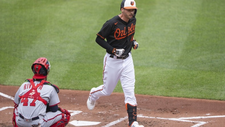 Jul 25, 2021; Baltimore, Maryland, USA; Baltimore Orioles designated hitter Trey Mancini (16) crosses home plate after hitting a home run during the first inning against the Washington Nationals at Orioles Park at Camden Yards. Mandatory Credit: Gregory Fisher-USA TODAY Sports