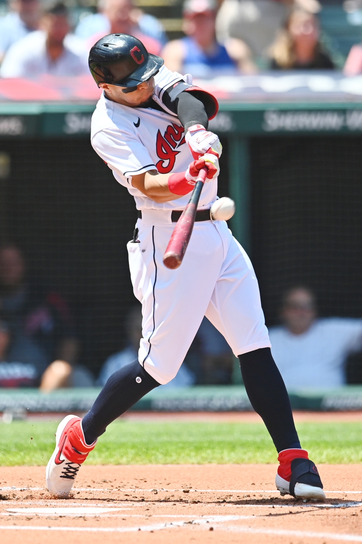 Jul 25, 2021; Cleveland, Ohio, USA; Cleveland Indians second baseman Cesar Hernandez (7) hits a home run during the first inning against the Tampa Bay Rays at Progressive Field. Mandatory Credit: Ken Blaze-USA TODAY Sports