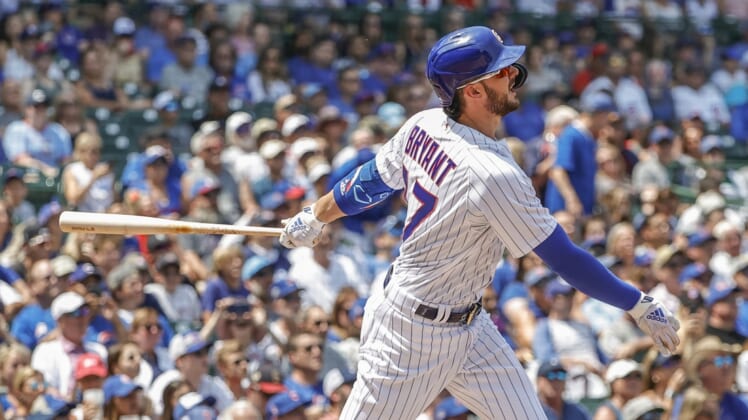 Chicago Cubs Kris Bryant (17) runs to first base after hitting a