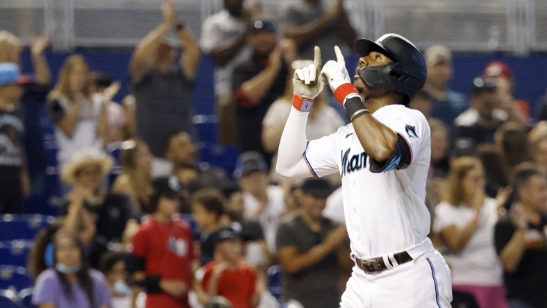 Jul 25, 2021; Miami, Florida, USA; Miami Marlins batter Lewis Brinson (25) reacts after hitting a three-run home run during the sixth inning against the San Diego Padres at loanDepot Park. Mandatory Credit: Rhona Wise-USA TODAY Sports