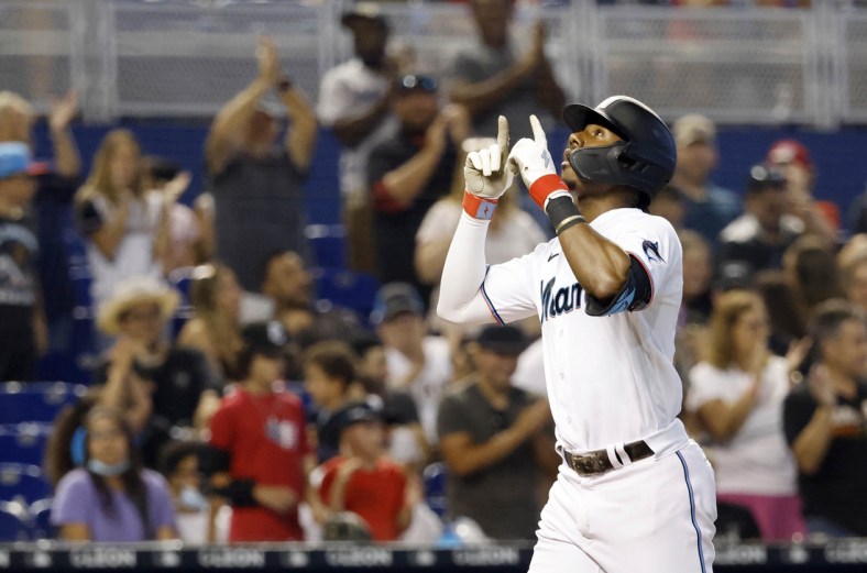 Jul 25, 2021; Miami, Florida, USA; Miami Marlins batter Lewis Brinson (25) reacts after hitting a three-run home run during the sixth inning against the San Diego Padres at loanDepot Park. Mandatory Credit: Rhona Wise-USA TODAY Sports