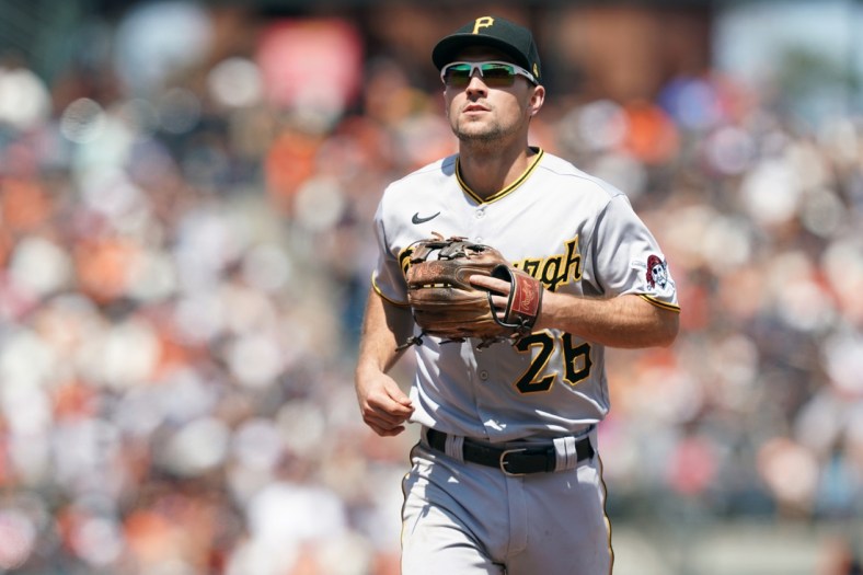 Jul 25, 2021; San Francisco, California, USA; Pittsburgh Pirates second baseman Adam Frazier (26) jogs off the field at the end of the sixth inning against the San Francisco Giants at Oracle Park. Mandatory Credit: Darren Yamashita-USA TODAY Sports