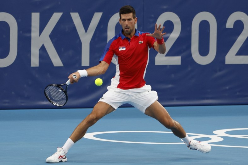 Jul 26, 2021; Tokyo, Japan; Novak Djokovic of Serbia hits a forehand against Jan-Lennard Struff of Germany (not pictured) in a second round mens' singles match during the Tokyo 2020 Olympic Summer Games at Ariake Tennis Park. Mandatory Credit: Geoff Burke-USA TODAY Sports