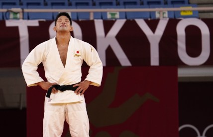 Jul 26, 2021; Tokyo, Japan; Shohei Ono (JPN) reacts after winning the men's 73 kg gold medal during the Tokyo 2020 Olympic Summer Games at Nippon Budokan. Mandatory Credit: Mandi Wright-USA TODAY Sports