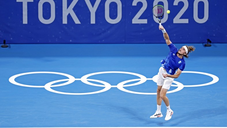 Jul 27, 2021; Tokyo, Japan; Stefanos Tsitsipas (GRE) plays Frances Tiafoe (USA) in the mens tennis first round singles during the Tokyo 2020 Olympic Summer Games at Ariake Tennis Park. Mandatory Credit: Yukihito Taguchi-USA TODAY Sports