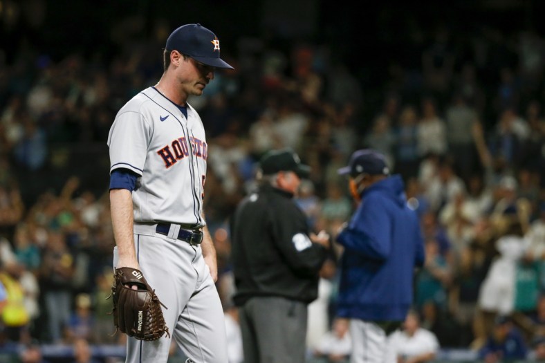 Jul 26, 2021; Seattle, Washington, USA; Houston Astros relief pitcher Brooks Raley (58) walks to the locker room after being ejected for hitting a batter against the Seattle Mariners during the eighth inning at T-Mobile Park. Mandatory Credit: Joe Nicholson-USA TODAY Sports