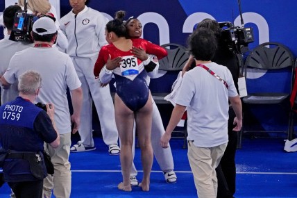 Jul 27, 2021; Tokyo, Japan; Sunisa Lee (USA) reacts with Simone Biles (USA) in the women's team final during the Tokyo 2020 Olympic Summer Games at Ariake Gymnastics Centre. Mandatory Credit: Robert Deutsch-USA TODAY Sports