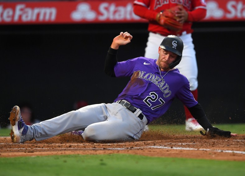 Jul 27, 2021; Anaheim, California, USA;  Colorado Rockies shortstop Trevor Story (27) scores on a single by right fielder Charlie Blackmon (not pictured) against the Colorado Rockies in the third inning at Angel Stadium. Mandatory Credit: Jayne Kamin-Oncea-USA TODAY Sports