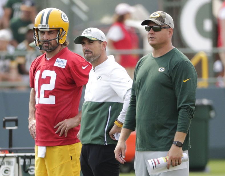 July 28, 2021; Green Bay, WI, USA; Green Bay Packers quarterback Aaron Rodgers (12), head coach Matt LaFleur and quarterbacks coach Luke Getsy, right, participate in training camp Wednesday, July 28, 2021, in Green Bay, Wis. Mandatory Credit: Dan Powers-USA TODAY NETWORK