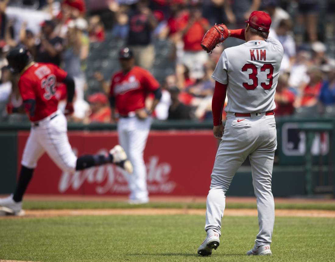 Jul 28, 2021; Cleveland, Ohio, USA; St. Louis Cardinals starting pitcher Kwang Hyun Kim (33) wipes his face during the third inning after giving up a second solo home run to Cleveland Indians right fielder Franmil Reyes at Progressive Field. Mandatory Credit: Scott Galvin-USA TODAY Sports