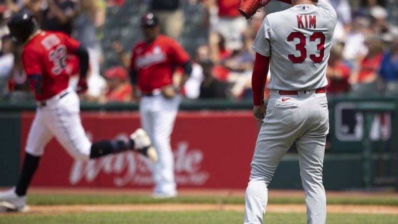 Jul 28, 2021; Cleveland, Ohio, USA; St. Louis Cardinals starting pitcher Kwang Hyun Kim (33) wipes his face during the third inning after giving up a second solo home run to Cleveland Indians right fielder Franmil Reyes at Progressive Field. Mandatory Credit: Scott Galvin-USA TODAY Sports