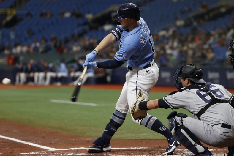 Jul 29, 2021; St. Petersburg, Florida, USA;  Tampa Bay Rays designated hitter Austin Meadows (17) hits a three-run home run during the first inning against the New York Yankees at Tropicana Field. Mandatory Credit: Kim Klement-USA TODAY Sports